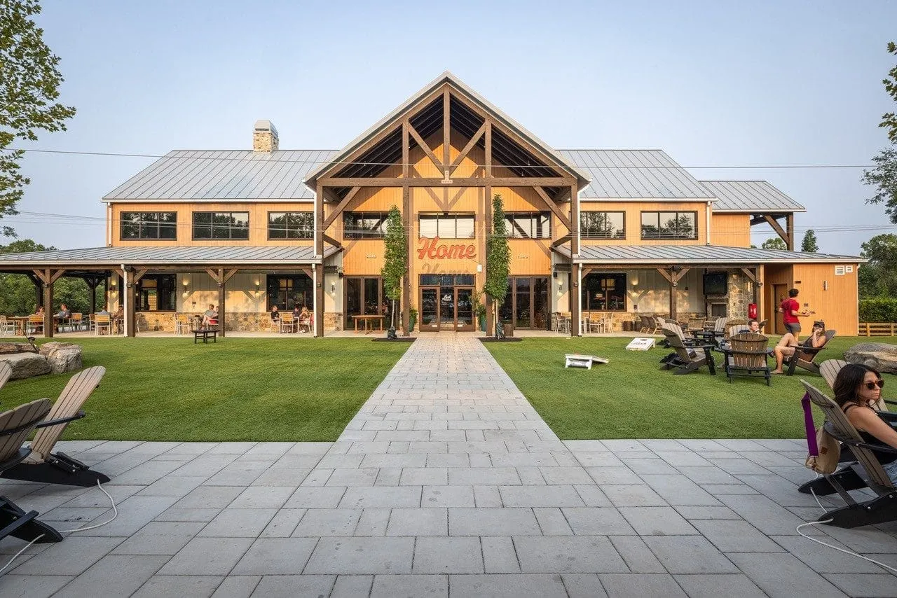 Front elevation of the Lark Brewing timber-frame brewery and event hall, Aldie Virginia — Hearthstone Design Build