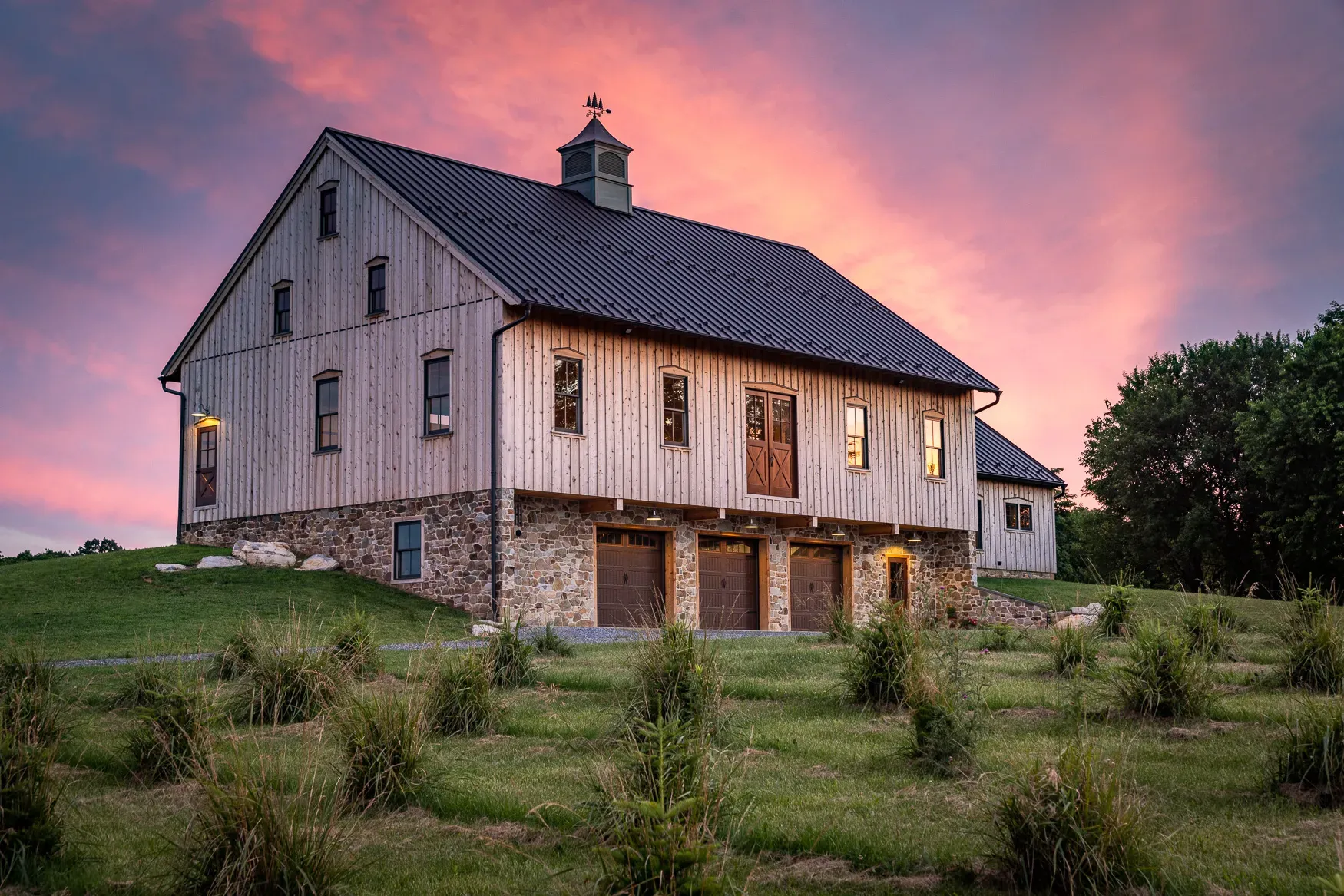 Berryville Timber Frame Barn exterior with stone foundation and wood siding in Clarke County, Virginia