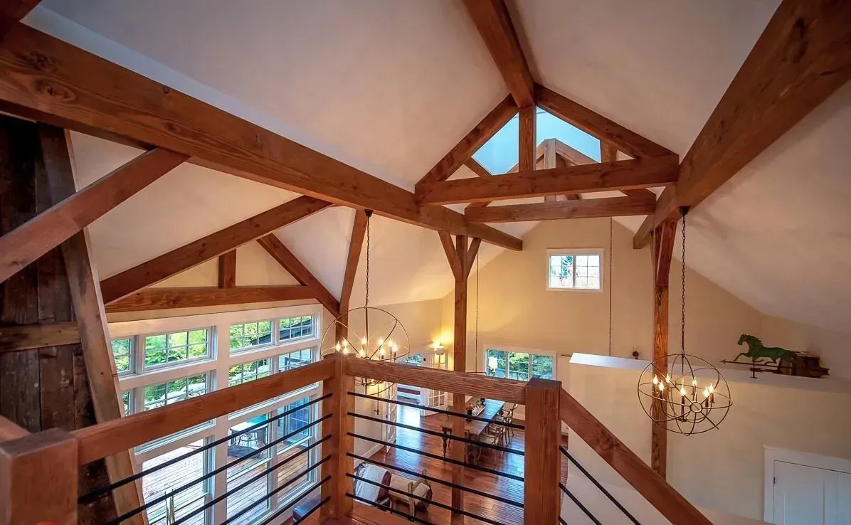 Timber frame home interior with exposed beams and open floor plan