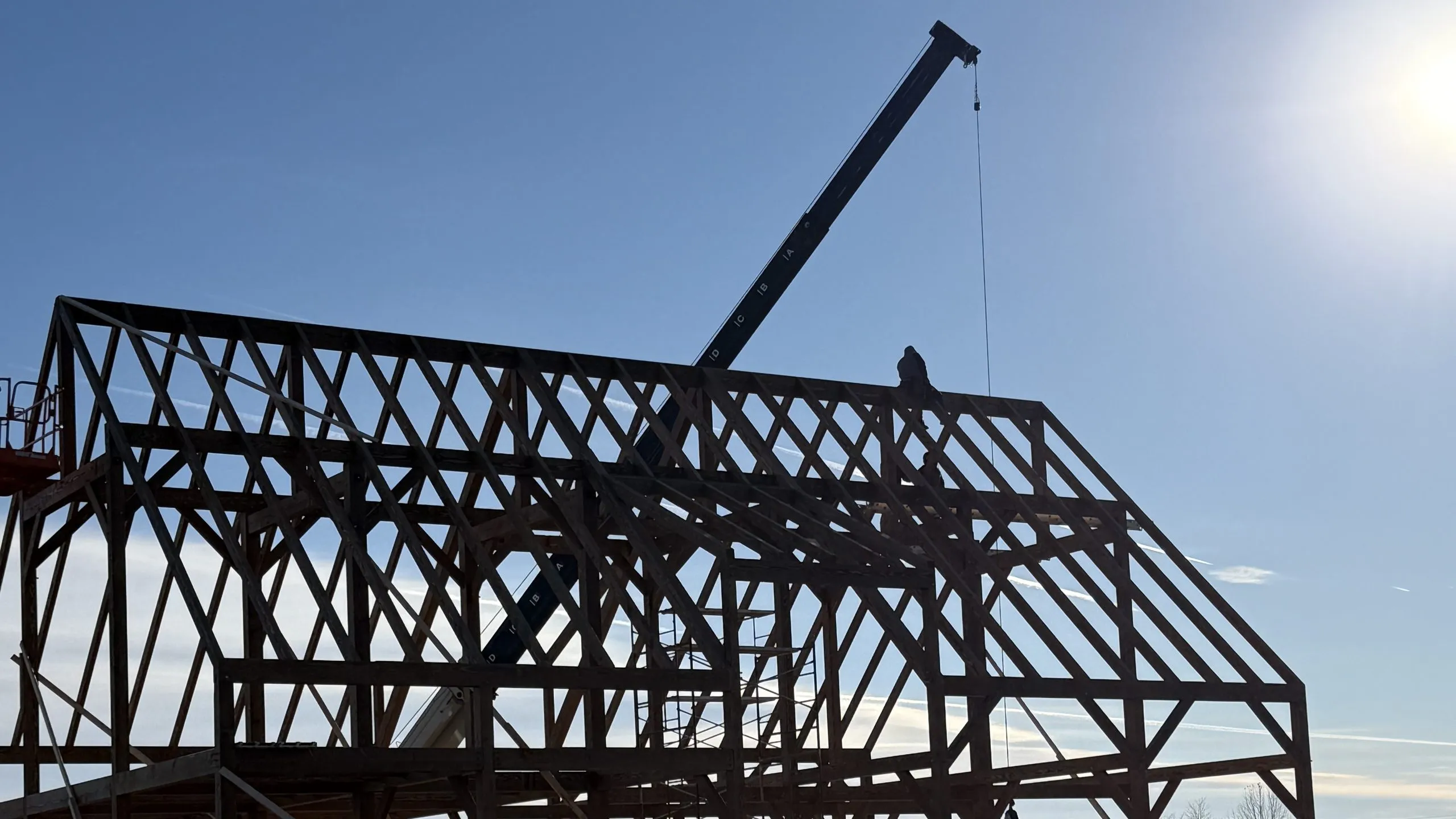 Timber frame raising in progress on a Virginia estate property