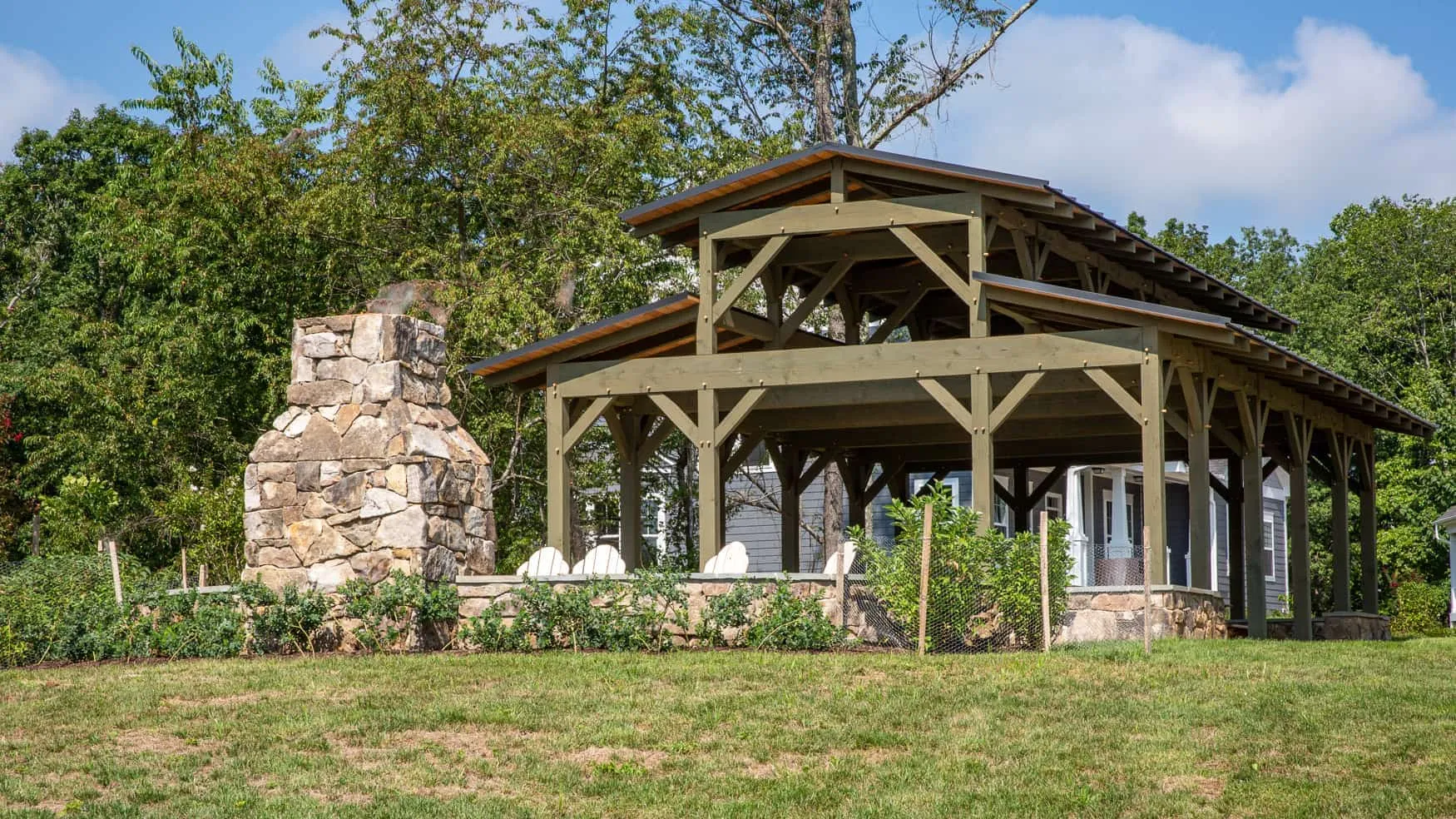 Estate pavilion with outdoor fireplace and natural stone terrace at a Loudoun County Virginia property